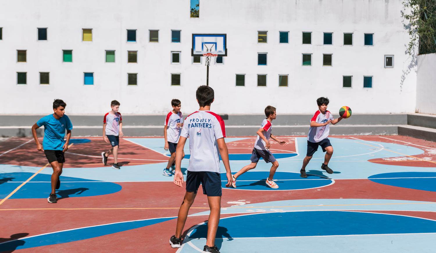 Pupils playing basketball